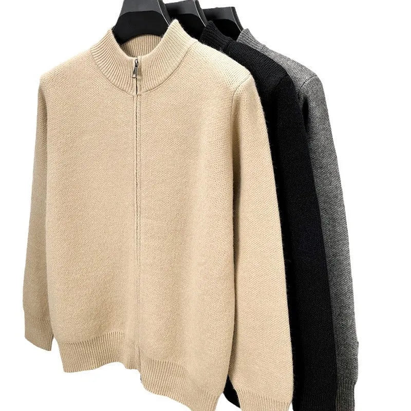 Man wearing a beige stand collar knitted zip cardigan in a loose fit.