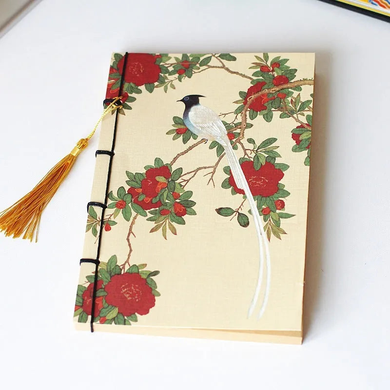 Antique wire-bound notebook with embossed cowhide cover and black wax rope binding