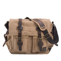 Men's canvas crossbody shoulder bag with cowhide trim showing internal organisers