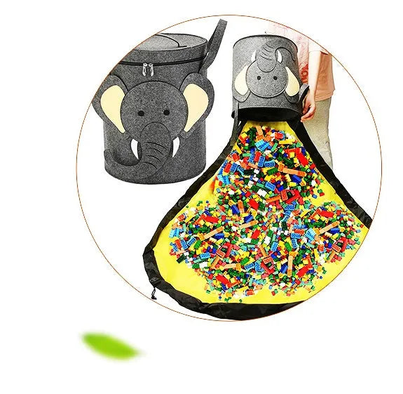 Green felt cube storage bag with pull rope closure lying flat as a play mat.