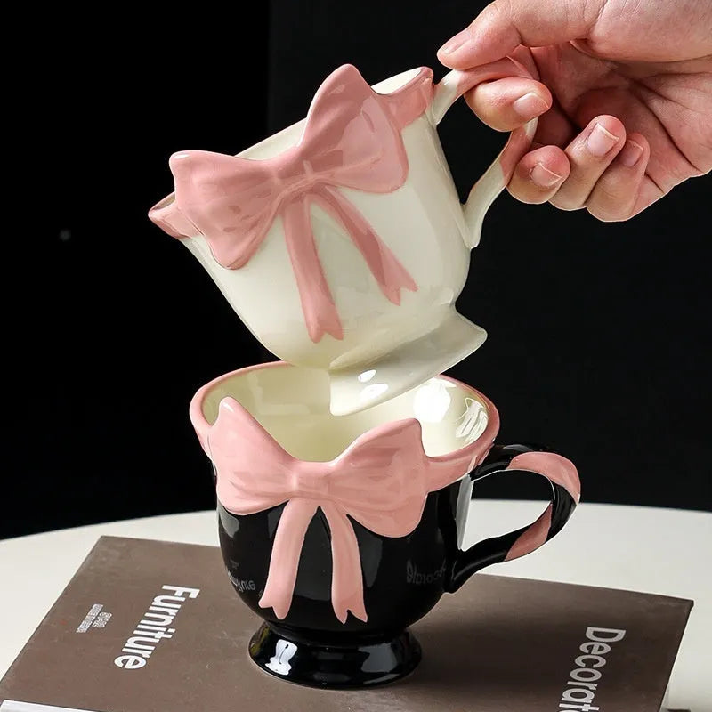 Ceramic heart bow mug with 350ml capacity in black pink colour option