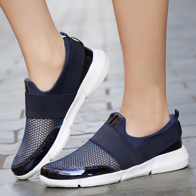 Women's blue mesh summer sneakers with low-top design on hard floor