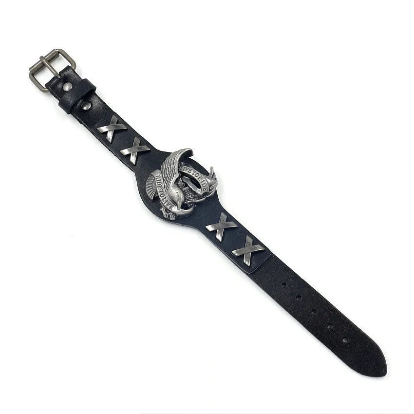 Black geometric leather bracelet with a detailed alloy eagle watch-button clasp on a wrist.