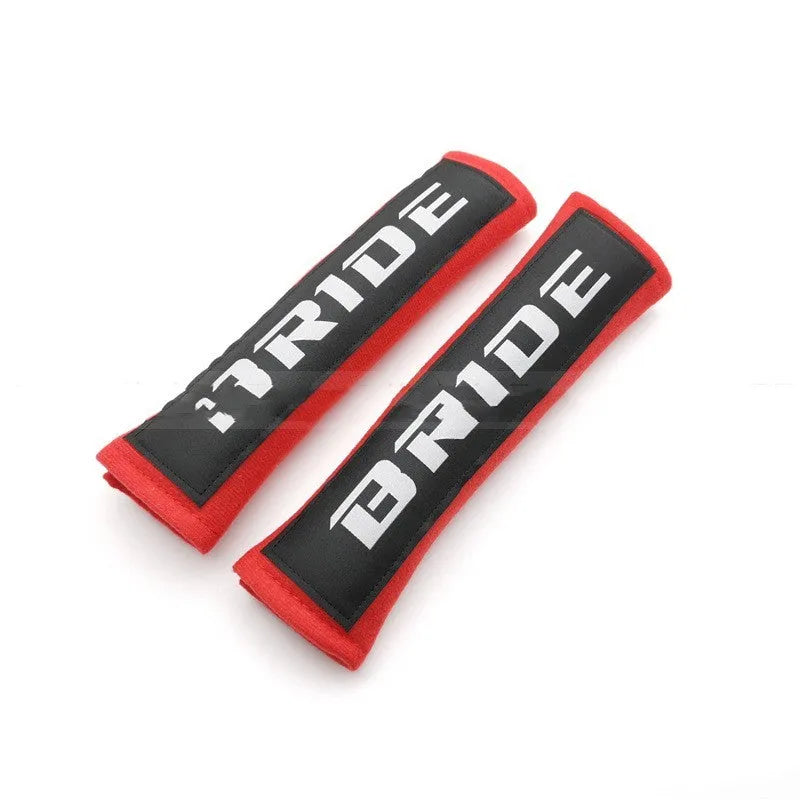 Car seat belt shoulder pads in black, blue and red with cotton fabric and sponge padding