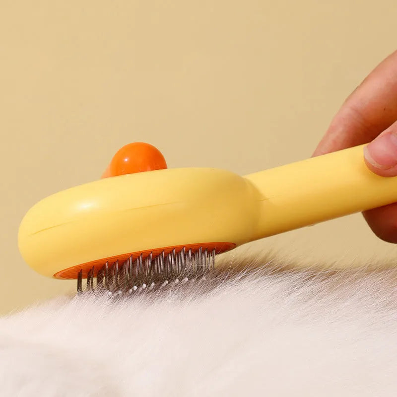 Small yellow cat comb brush with open-section design and fine needles for pet grooming