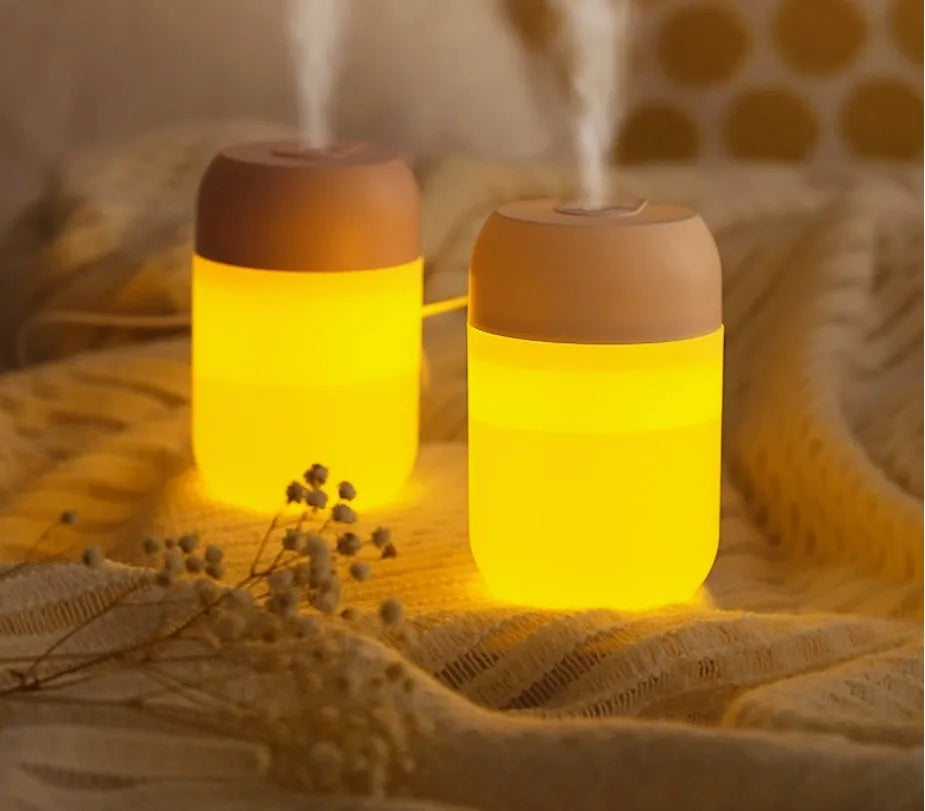 Small white cylindrical USB-powered humidifier with aromatherapy function
