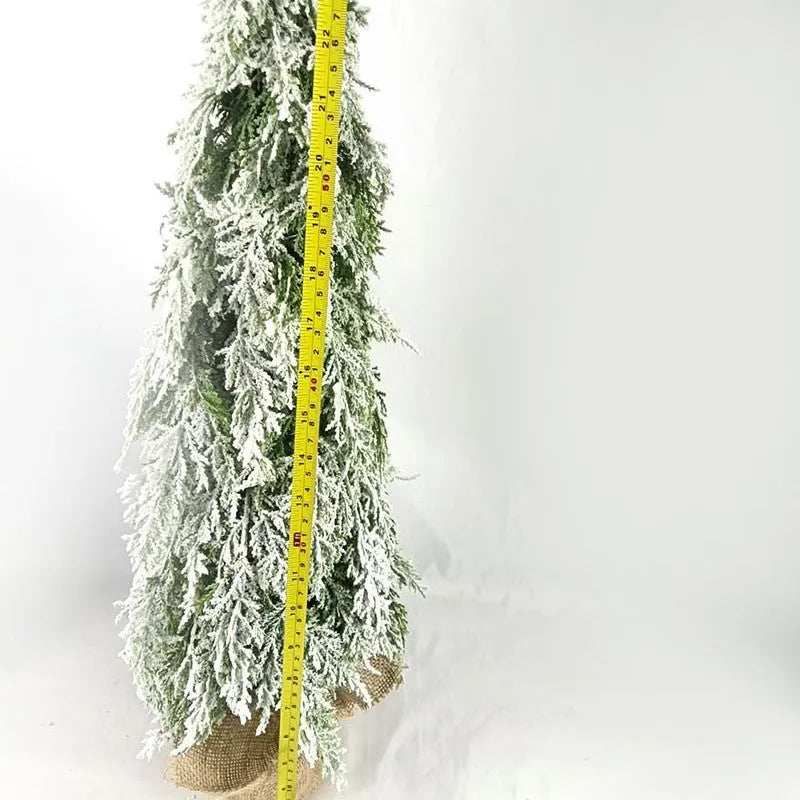 Small 24-inch desktop artificial Christmas tree with white snow sprayer effect and integrated coloured lights