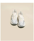 Women's pink and grey retro low-top sneaker with round toe and flat rubber sole.