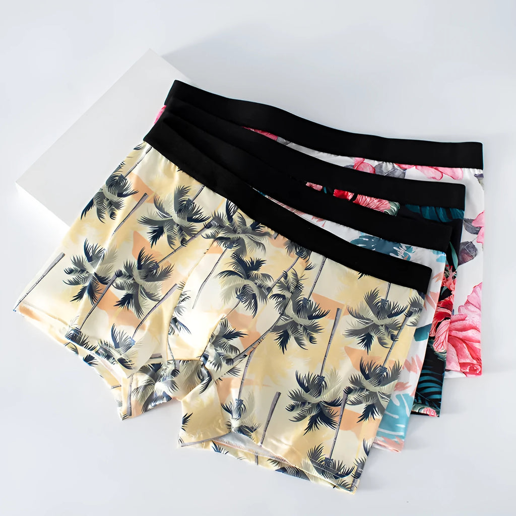 Men's ice silk underwear with fashion printing in mid waist design showing breathable polyester fabric