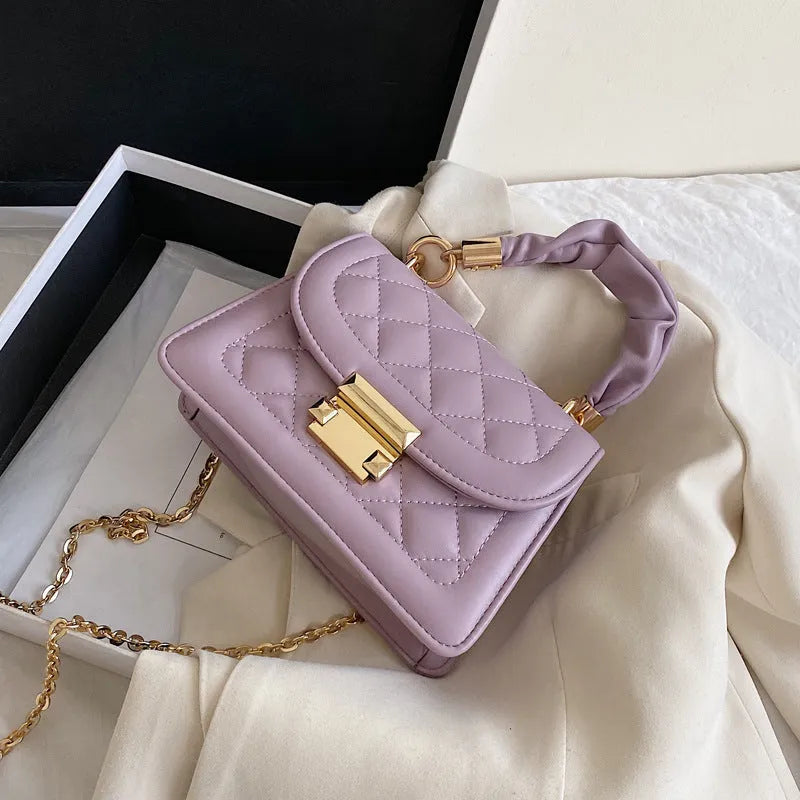 Korean style small square shoulder bag in purple with crossbody strap and structured design