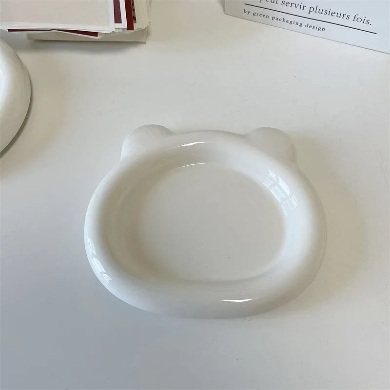 White ceramic ins-style plate with doodle design, shown in bear and round patterns in two sizes.