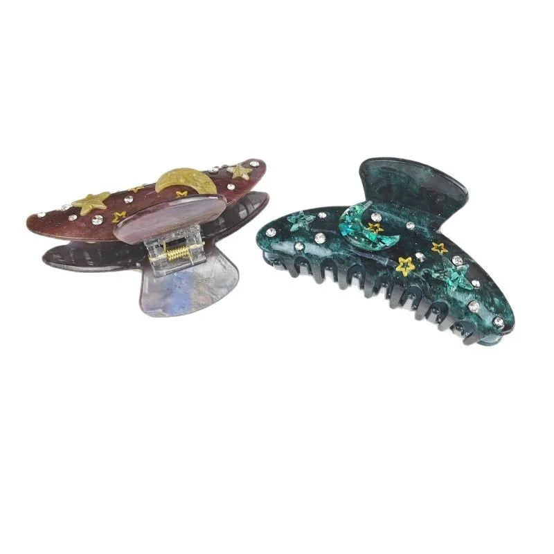 Oversized women's barrette with irregular starry sky pattern in cellulose acetate.