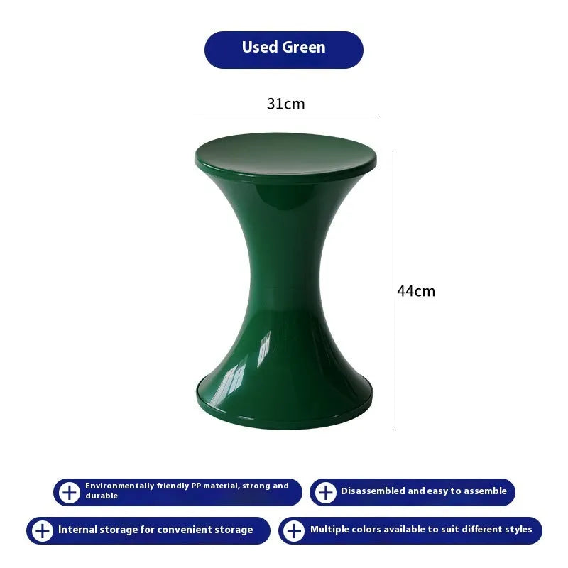 A plastic hourglass-shaped stool for changing shoes, shown in one of five available colours.