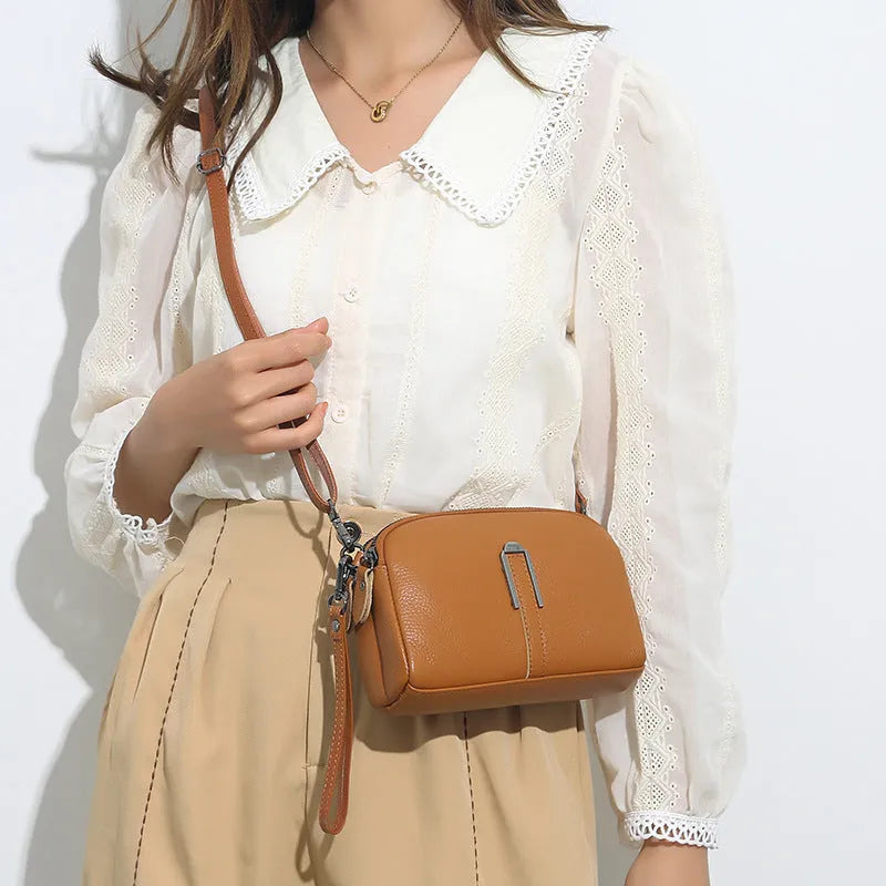 Genuine cowhide leather women's shoulder bag in horizontal square shape, 19x13x6cm, shown in a neutral colour.