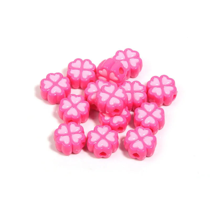 Mixed colour frosted acrylic four-leaf clover shaped beads, each 15mm in size.