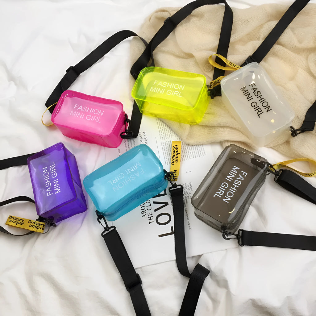 A transparent square jelly crossbody bag with a single adjustable shoulder strap.