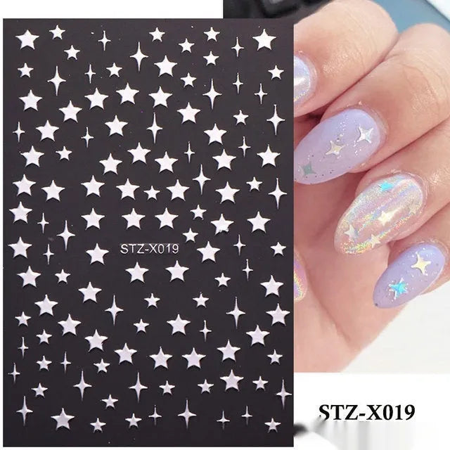 Set of 60 black and silver cartoon pattern nail strip stickers with plastic application patch.