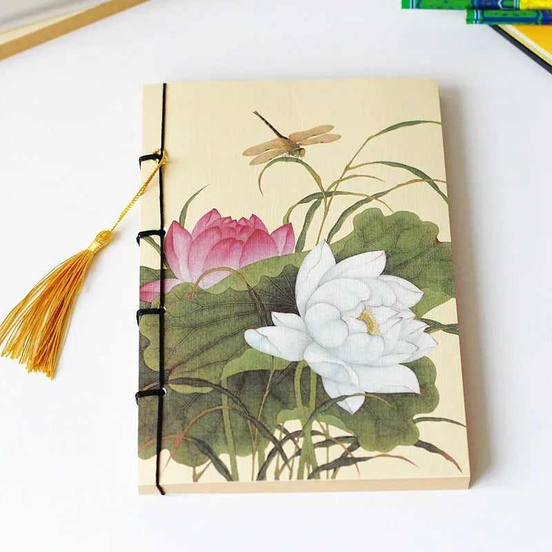 Antique wire-bound notebook with embossed cowhide cover and black wax rope binding