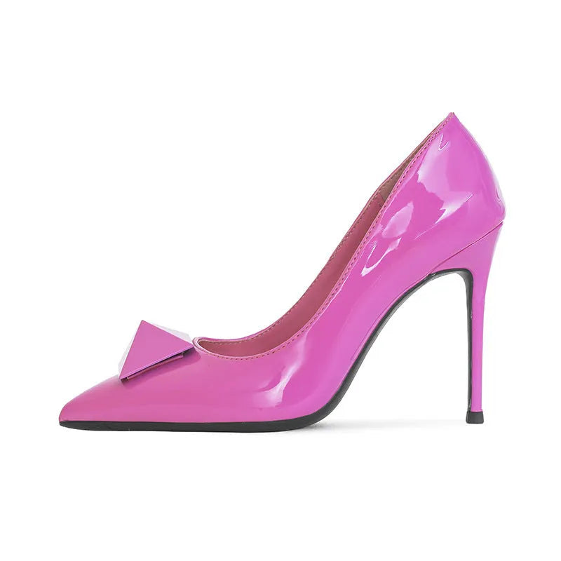 Pink women's pointed toe stiletto high heels with a rivet buckle on the ankle strap.
