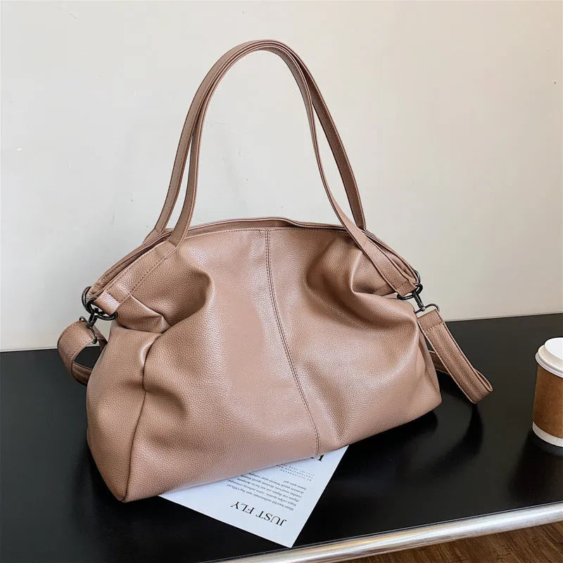 Large soft surface PU messenger tote bag in a horizontal square shape with a zip top and long shoulder strap.