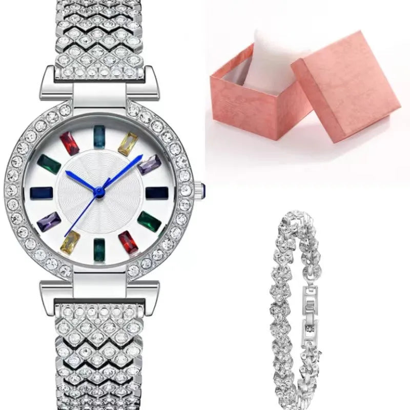 Gold quartz bracelet watch with round dial and alloy band on white background