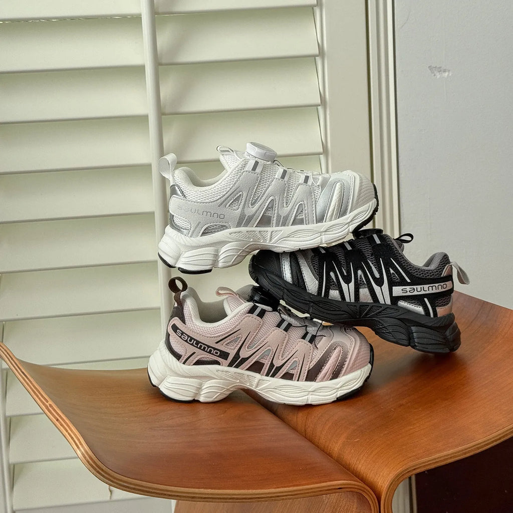 Girls' lightweight casual flats in black, beige, or pink with a breathable mesh upper.