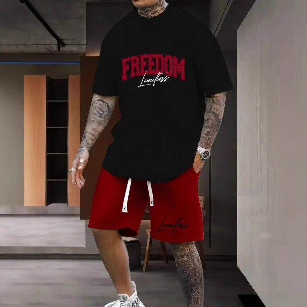 Man wearing a grey 3D printed letter short sleeve top and matching shorts suit set.