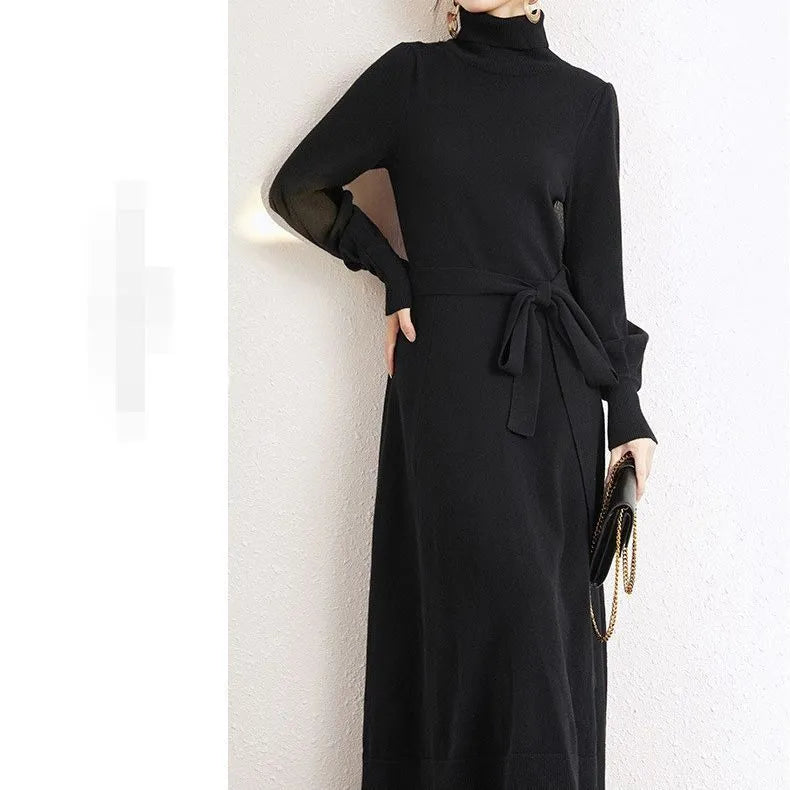 Loose-fit turtleneck knit dress for women with long sleeves, elastic waist, and a flowing mid-length princess skirt.