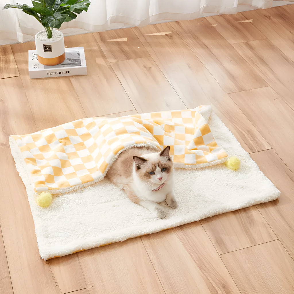 Plush fleece pet blanket with plaid pattern and fur ball decoration for cats and dogs