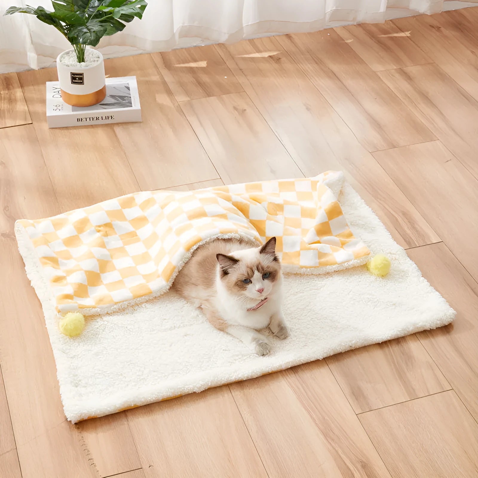 Plush fleece pet blanket with plaid pattern and fur ball decoration for cats and dogs