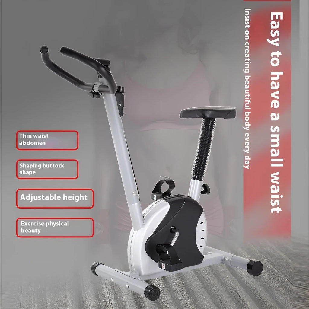 Grey spinning fitness bicycle with steel frame and foam handlebars for home office cardio training