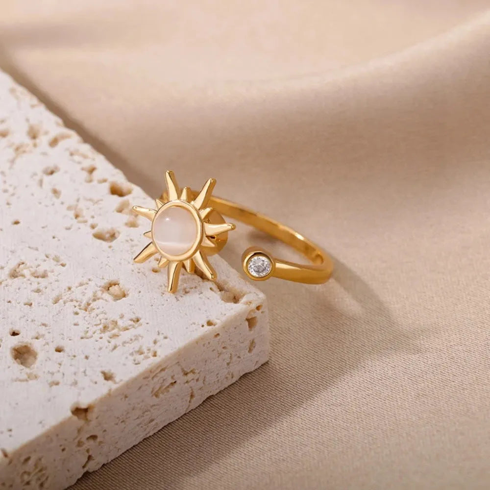 Gold and platinum rotatable decompression ring with adjustable opening and geometric round design