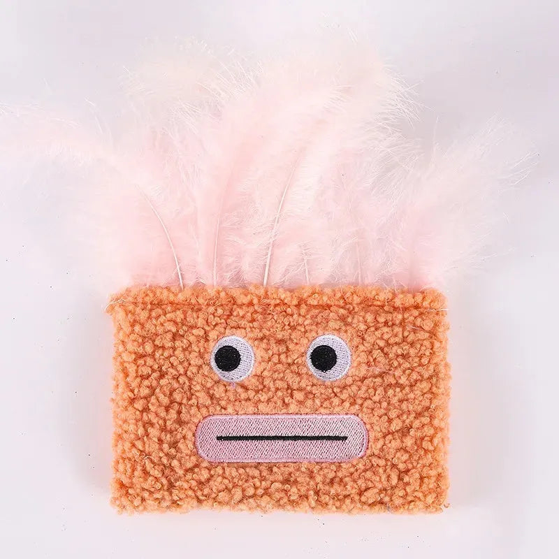Blue plush cat toy shaped like a big mouth explosion head with catnip inside.