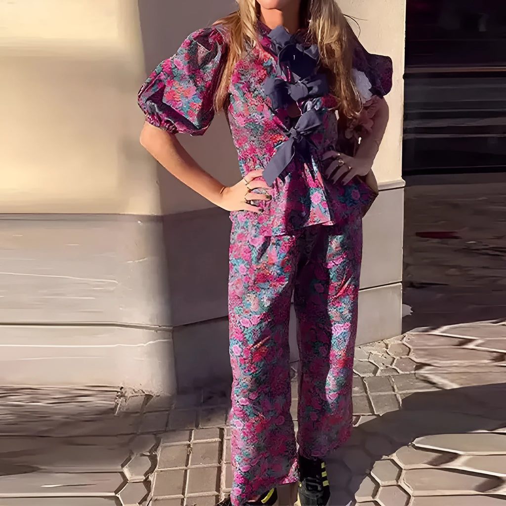 Floral printed tie-neck blouse and trousers suit set with puff sleeves.