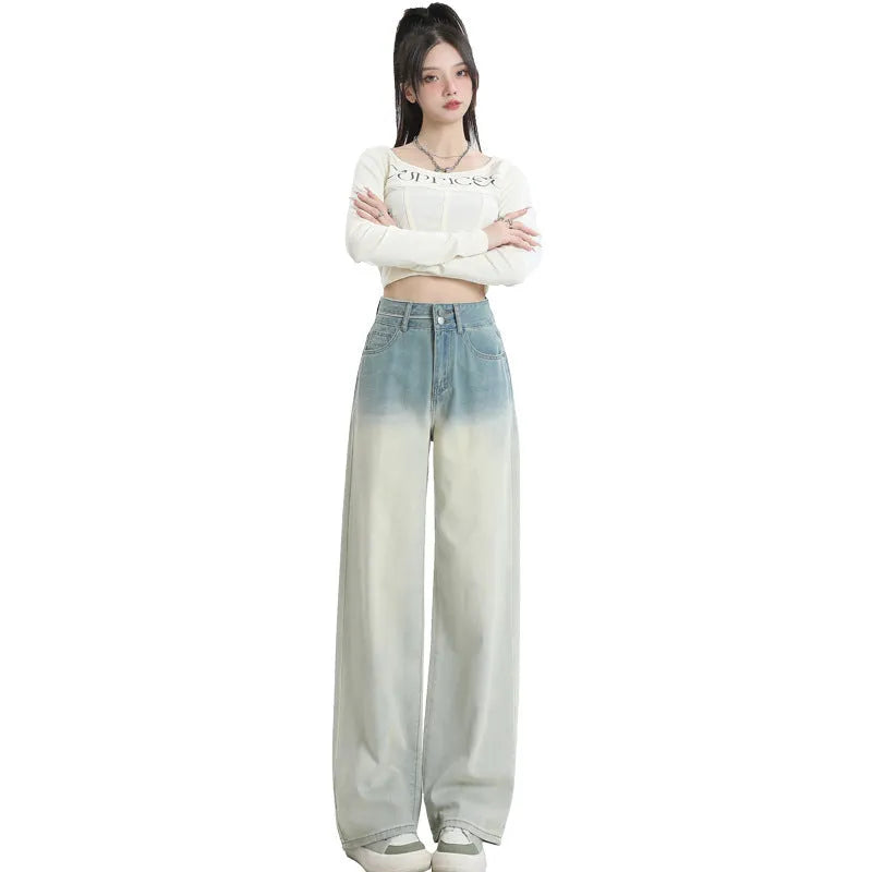 Women's gradient blue straight-leg denim trousers showing wider cut through thigh and calf