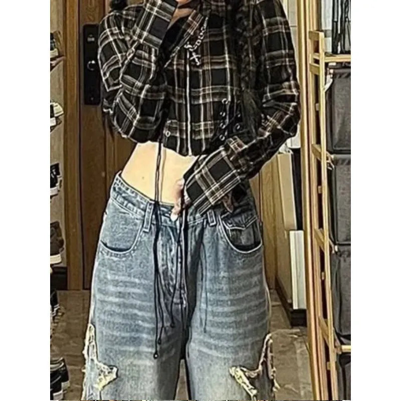 Blue high waist women's denim trousers with a straight wide-leg cut on a size chart.