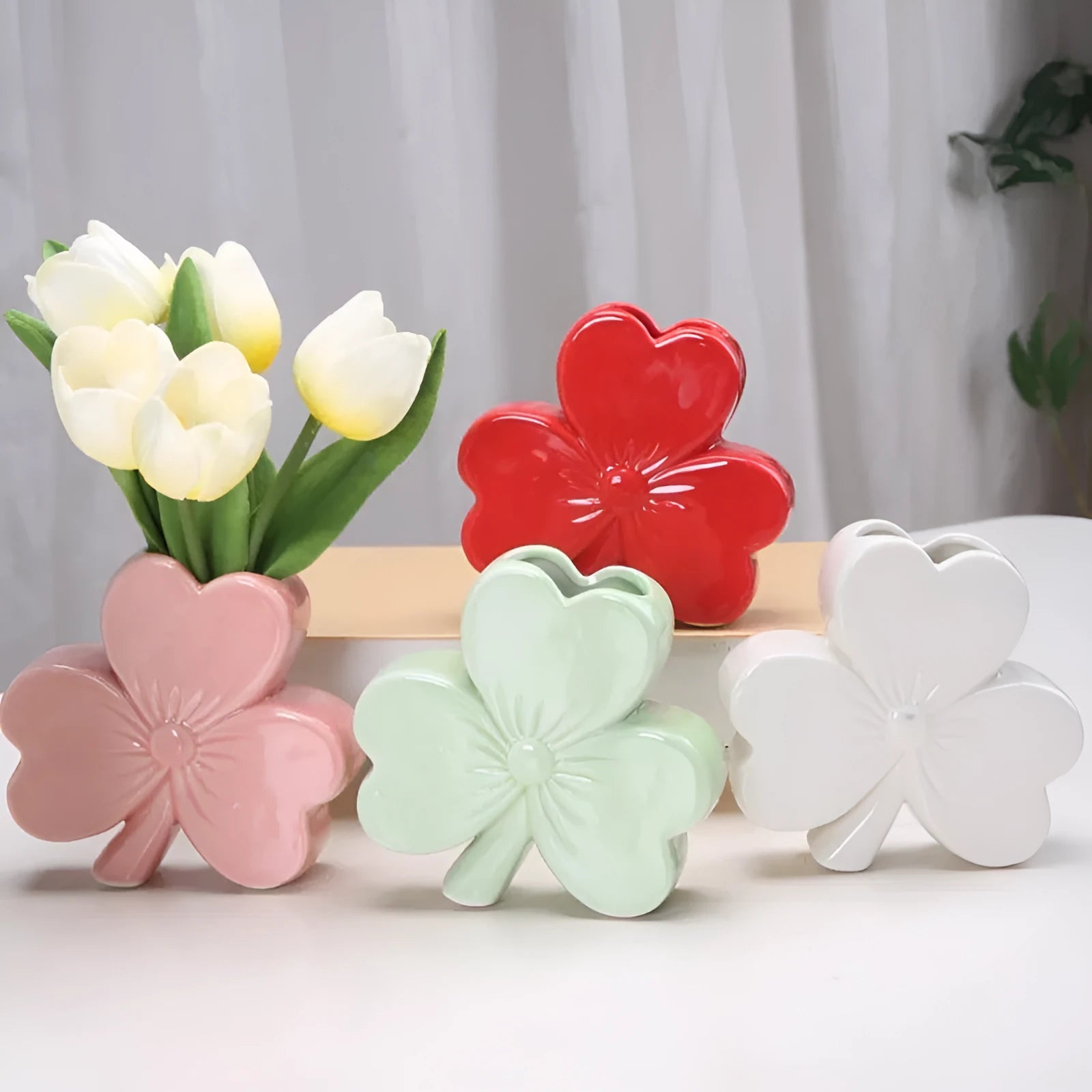 A white porcelain ceramic vase in European style for desktop decoration.