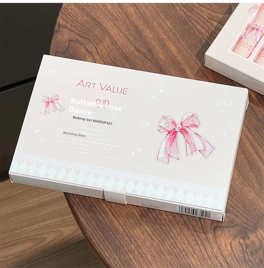 Butterfly Box Suite cosmetics set with four lip mud pots, powder blusher, and necklace in pink packaging