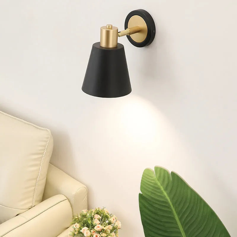 Nordic style iron table lamp with metal shade on a wooden bedside table
