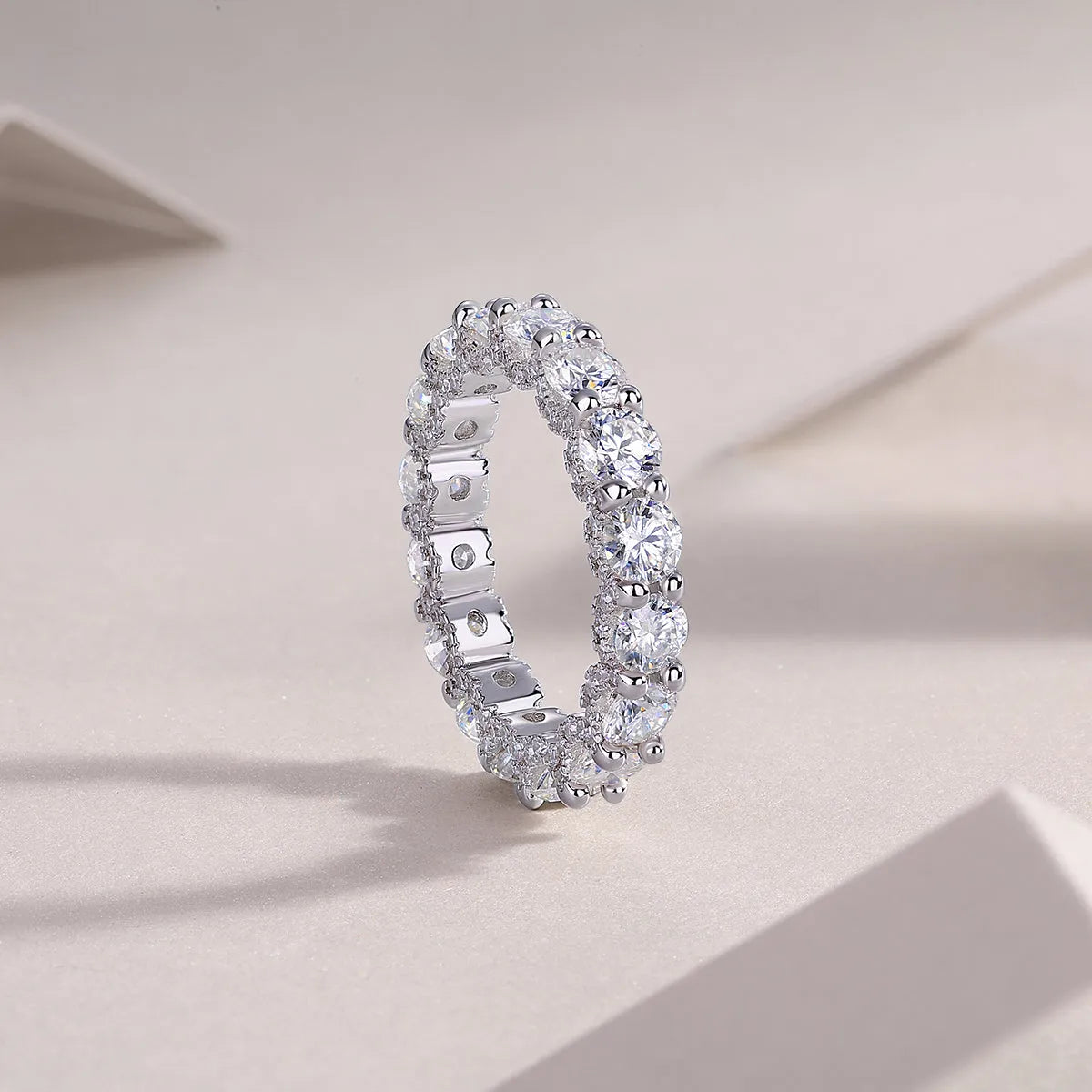 Ferris Wheel moissanite ring set in S925 silver with platinum plating on a white background