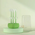 Blue, green, and purple dual-head silicone toothbrushes for pet dental care on a white background.