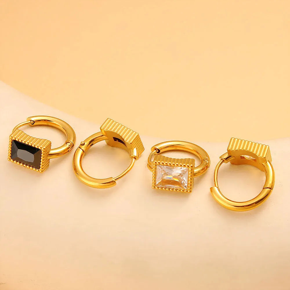 Stainless steel earrings with square zircon stones in geometric design with round ring elements