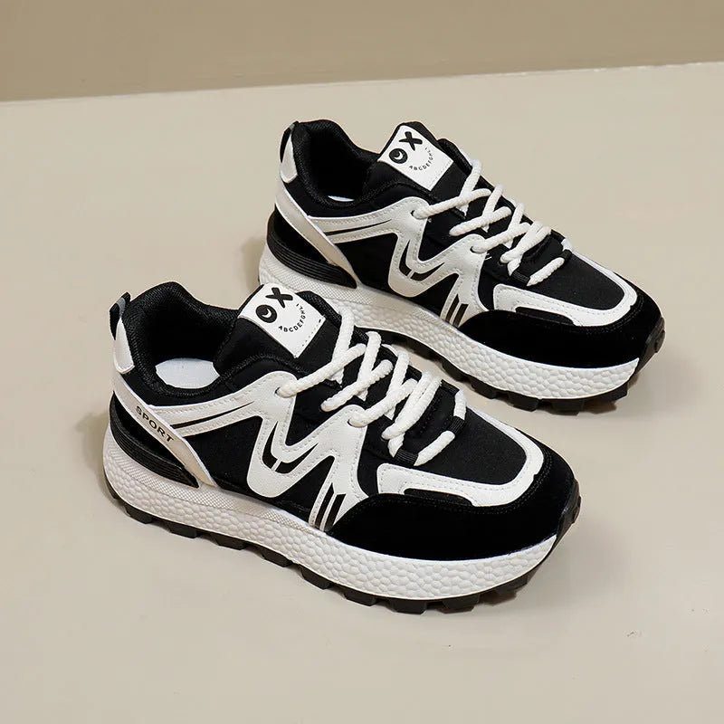 Women's black platform casual trainers with round toe and lace-up front on a white background.