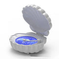 Retro blue vinyl record player shaped decorative shell lamp with LED lights on a wooden table.