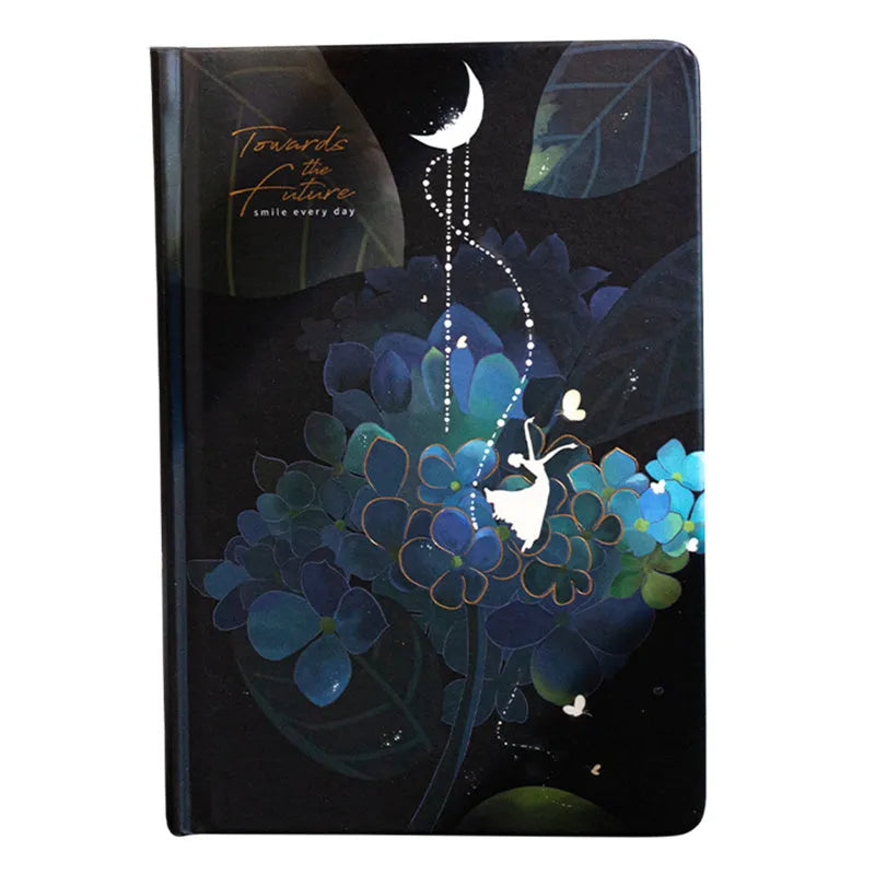 A5 notebook with luminous cover showing colour illustrations on open pages