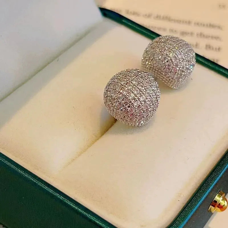 Geometric drop-shaped women's earrings with full diamond detailing and golden bean elements
