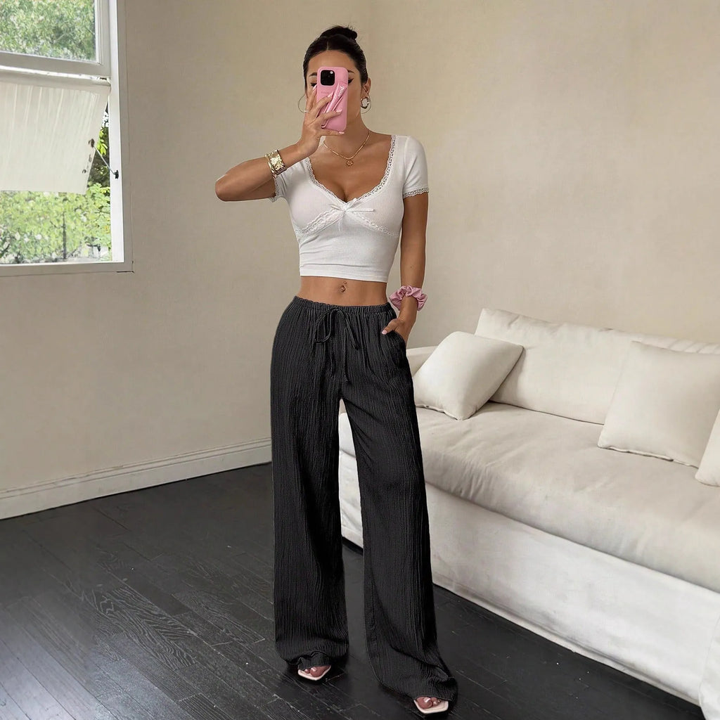 Women's black wide leg trousers with lace-up waist trimming on mid waist