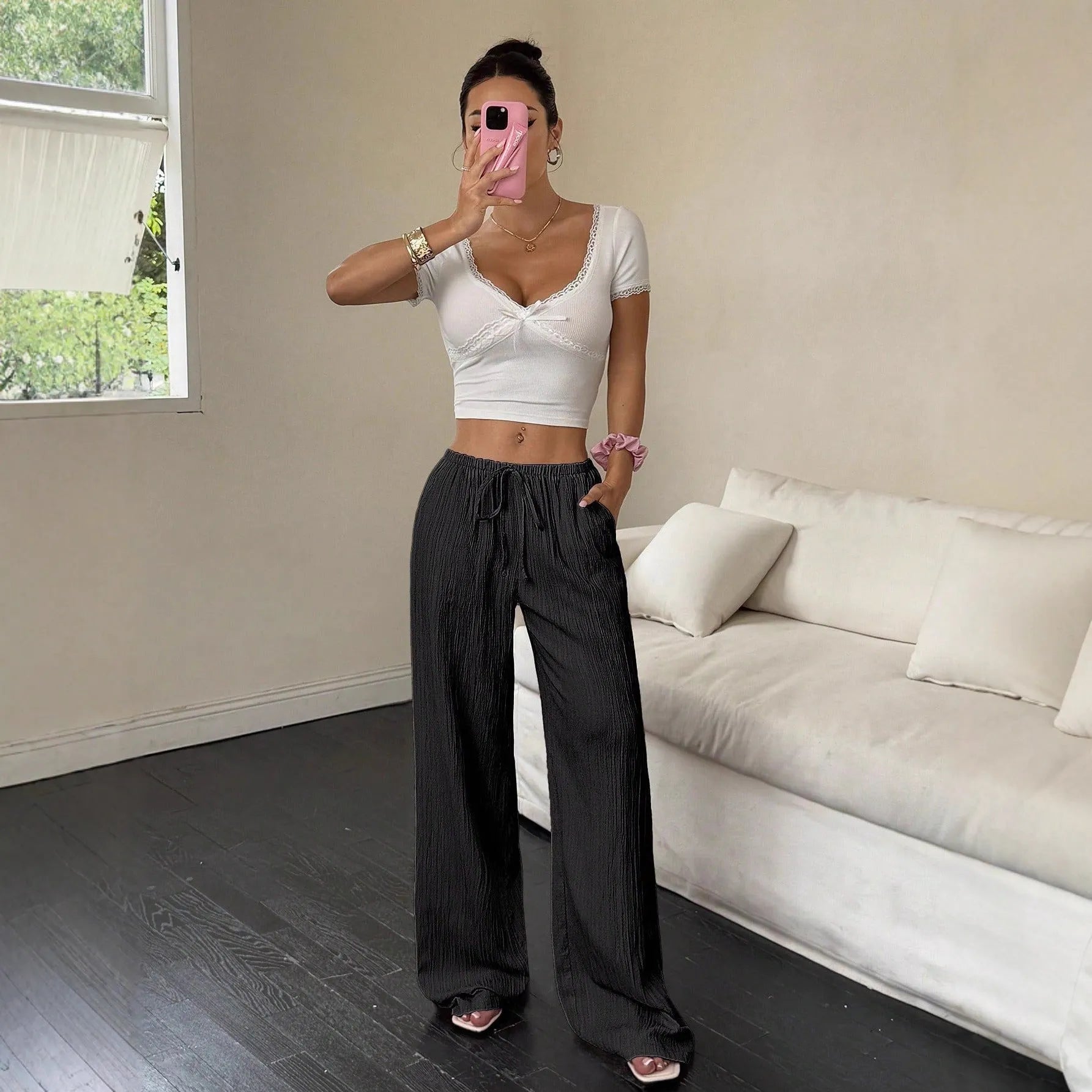 Women's black wide leg trousers with lace-up waist trimming on mid waist