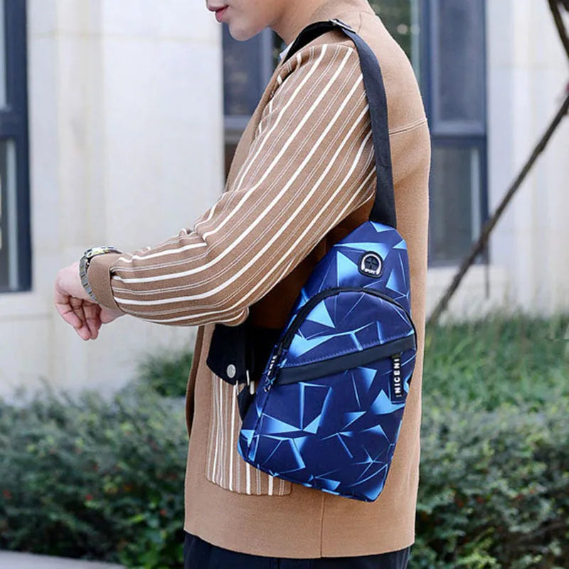 Men's blue crossbody sling bag with earphone hole showing square shape and strap