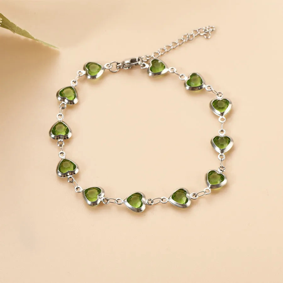 Devil's Eye Creative All-match Fashion Heart Bracelet in stainless steel on a wrist.